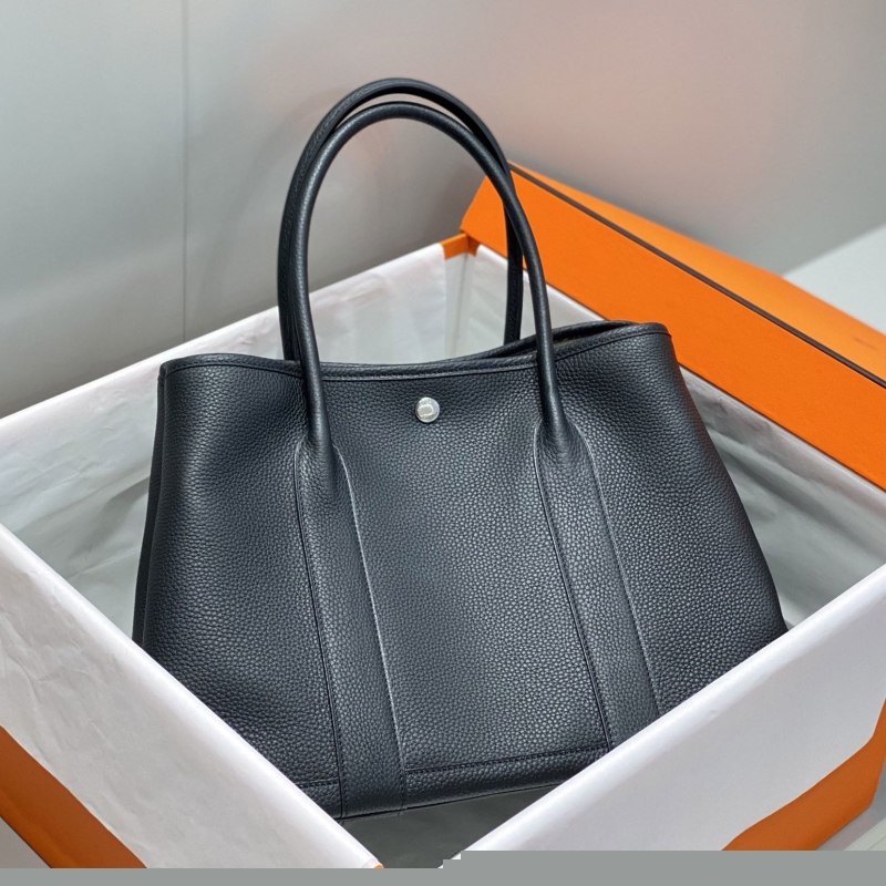 H**mes shopping bags
